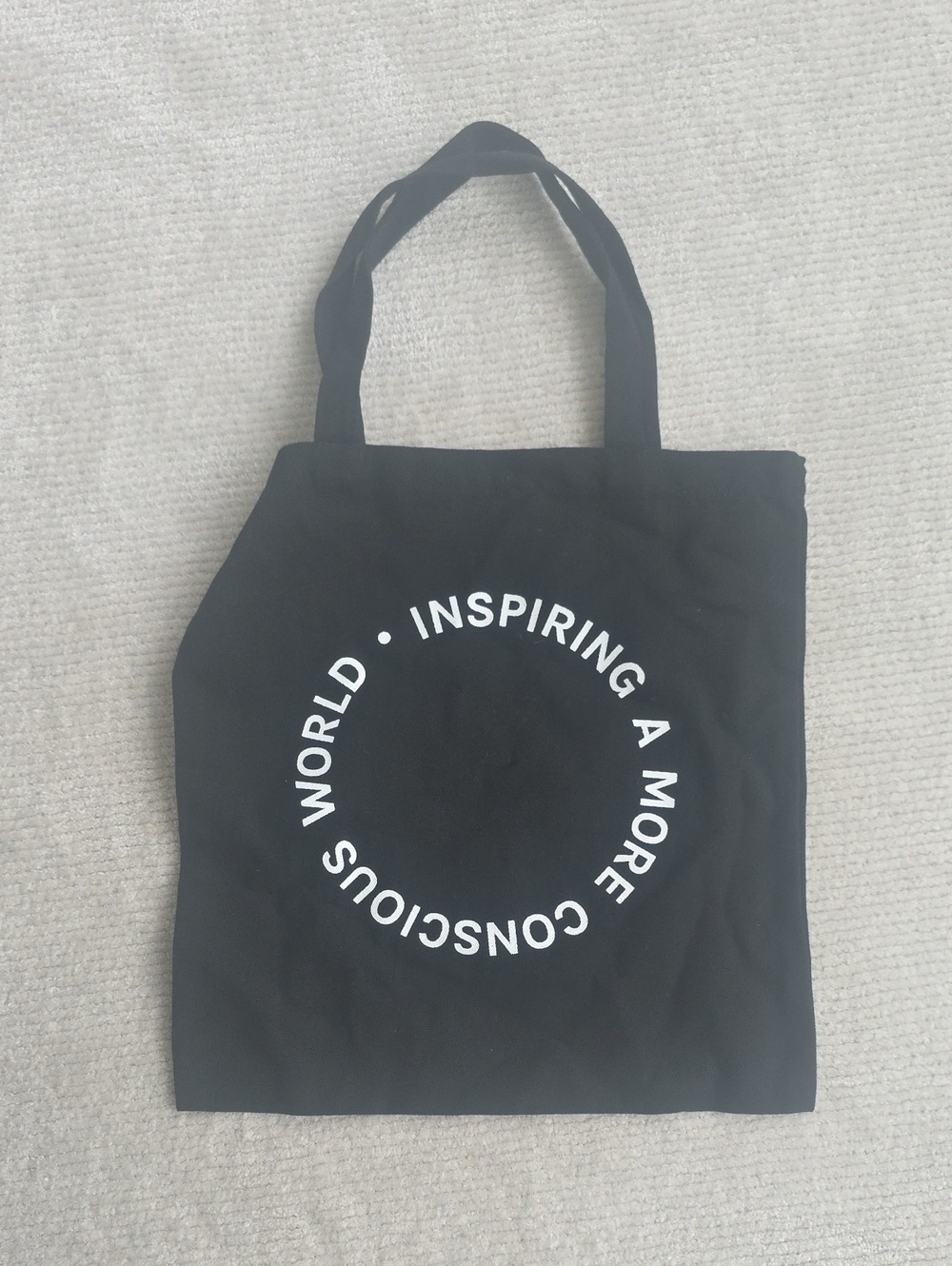 Black Canvas Tote Bag with White Circular Slogan